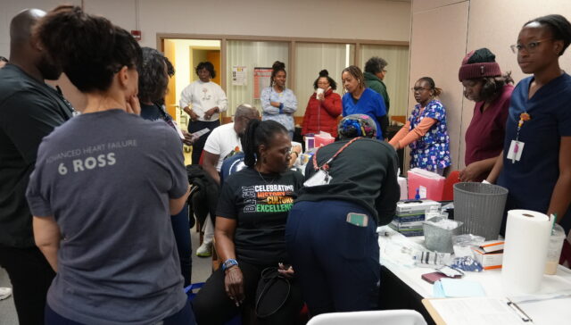 (A community member getting screened during the HIV/AIDS Awareness Day event) 