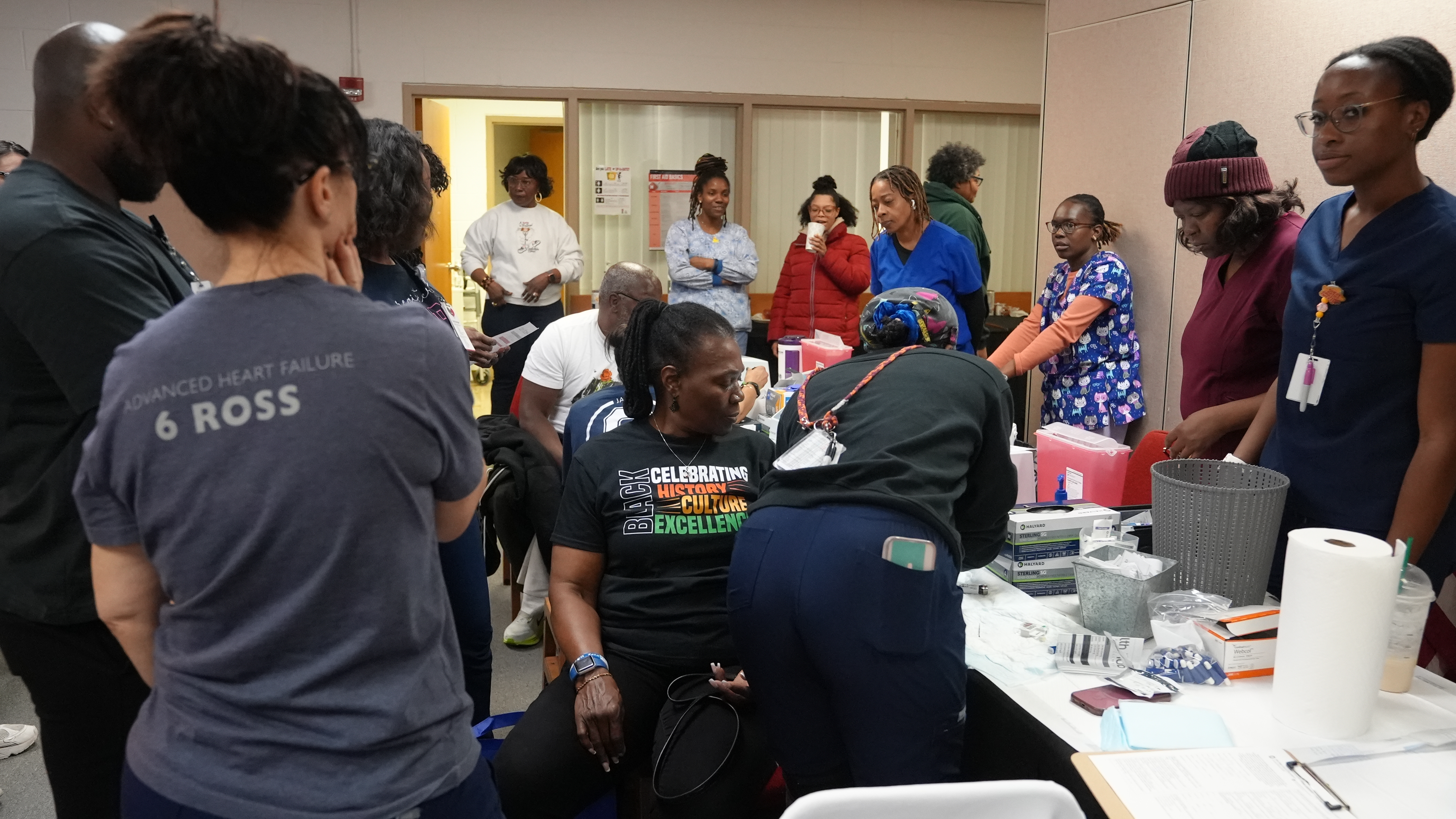 (A community member getting screened during the HIV/AIDS Awareness Day event) 